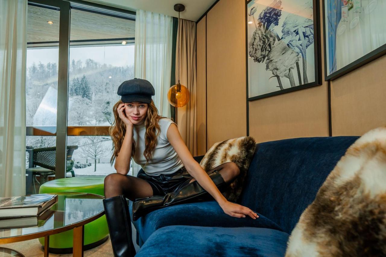 Five Zurich - Luxury City Resort Екстериор снимка A woman wearing a leather skirt